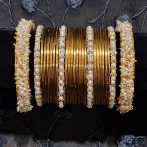 Gold metal bangles set with ivory and golden kangan bangles with pearls